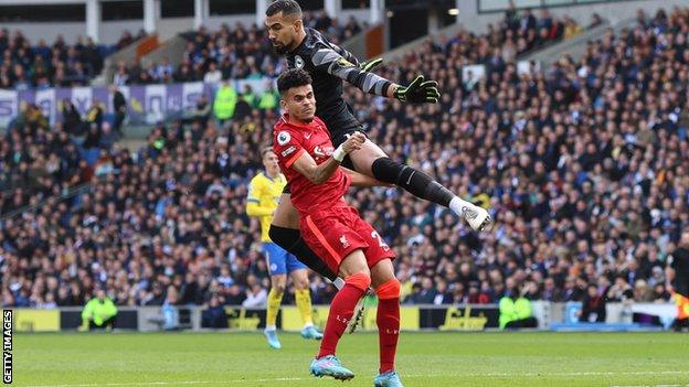 Robert Sanchez collides with Liverpool goalscorer Luis Diaz