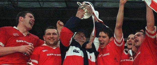 Tony McWhirter (left) celebrates as Ulster coach Harry Williams lifts the Heineken Cup at Lansdowne Road