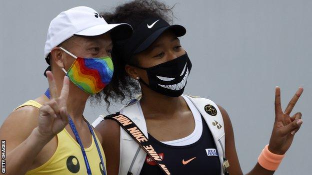 Naomi Osaka poses for a selfie at Flushing Meadows