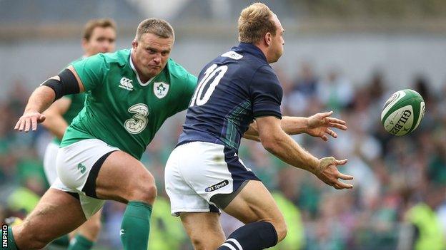 Nathan White is about to tackle Scotland fly-half Greig Tonks in Dublin