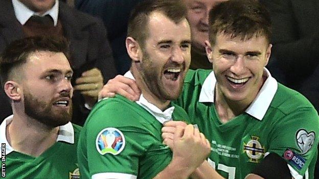 Niall McGinn celebrates scoring for Northern Ireland