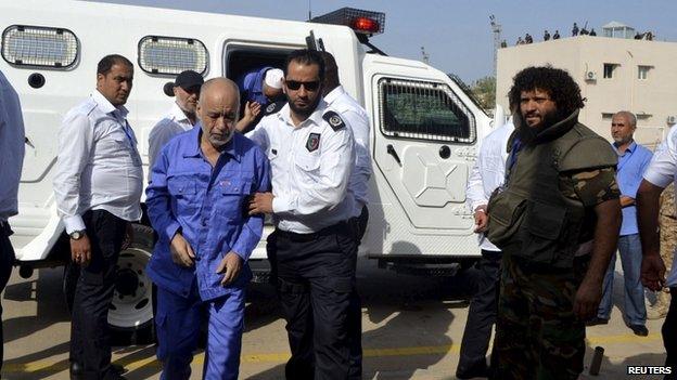 Former PM Baghdadi al-Mahmoudi arrives for a hearing at a courtroom in Tripoli in this September 19, 2013 file photo