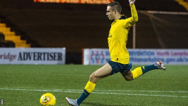 Celtic midfielder Liam Burt scores the winning penalty against Queen's Park