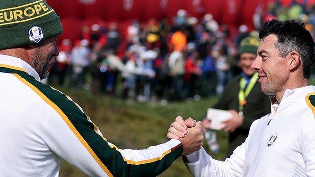 Lee Westwood and Rory McIlroy were shake hands after a practice round at the 2021 Ryder Cup