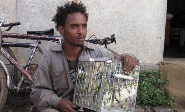 Man with his metal box used to rewind metal