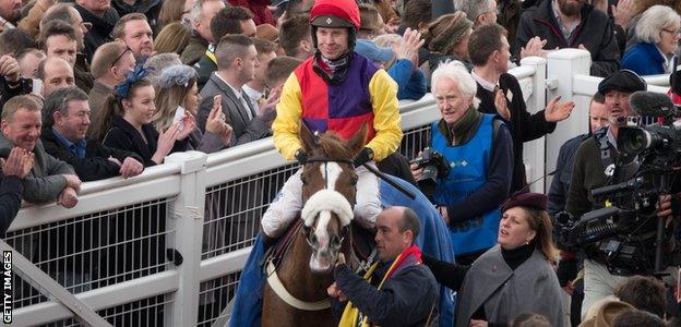 Jockey Richard Johnson celebrates after winning the 2018 Cheltenham Gold Cup Steeple Chase on Native River