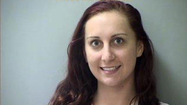 Brittany S Carter, 23, is seen in this photo provided by Hancock County Jail.