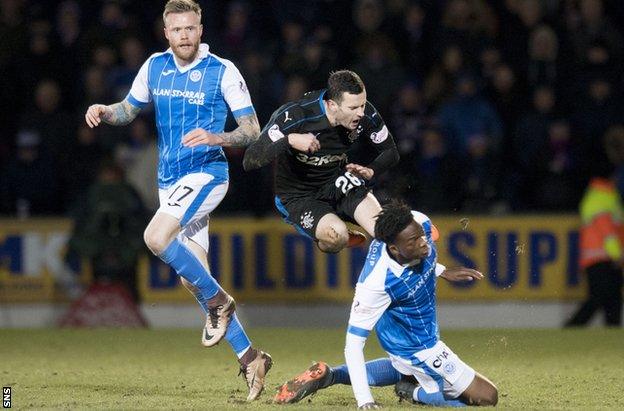 Rangers' Jamie Murphy is tackled by St Johnstone's Matty Willock