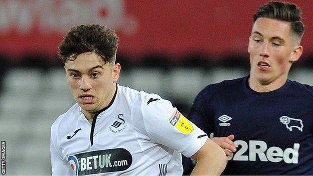 Daniel James goes past Harry Wilson