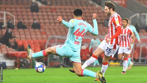 Stoke's leading scorer Nick Powell strokes the ball into the net to put his team in front