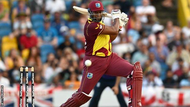 Kieron Pollard hits the ball while batting for West Indies