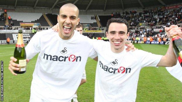 Darren Pratley and Leon Britton celebrate League One promotion to the Championship