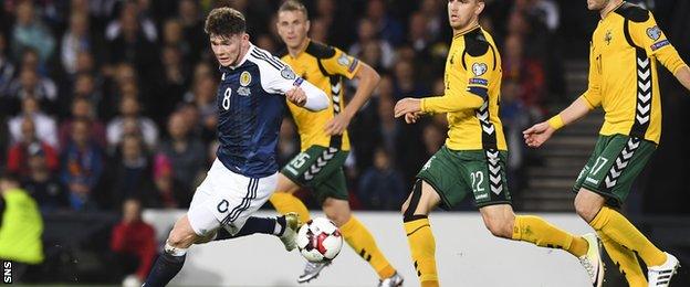 Oliver Burke takes on the Lithuania defence