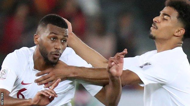 Qatar's Abdelaziz Hatim celebrates