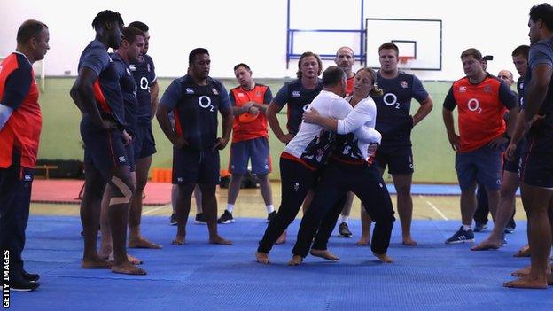 England players watch instructors