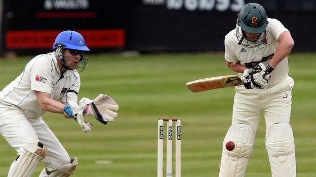 Lisburn batsman Richard McConkey defends his stumps against CSNI