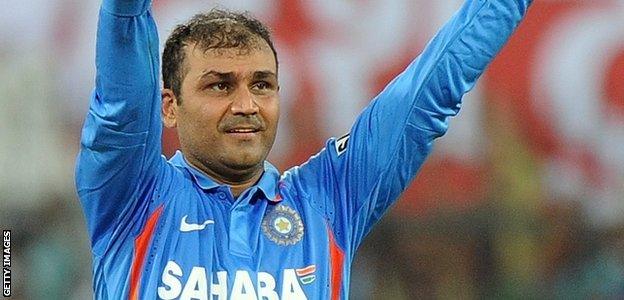 Virender Sehwag celebrates bringing up a century