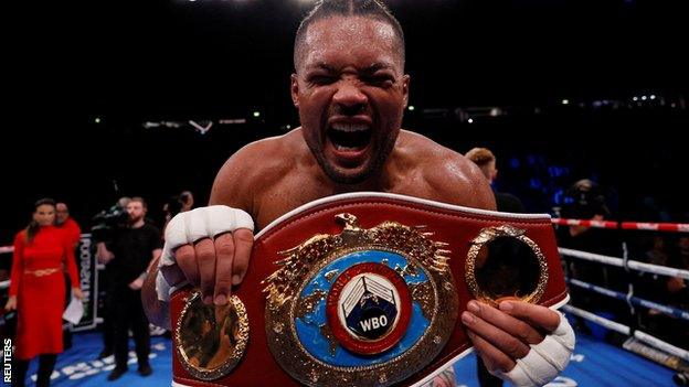 Joe Joyce celebrates with his WBO belt