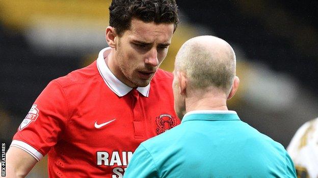 Mathieu Baudry speaks to the referee