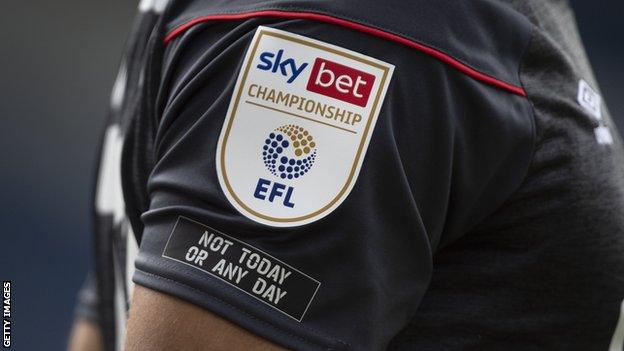 'Not Today or Any Day' logo on a Championship shirt