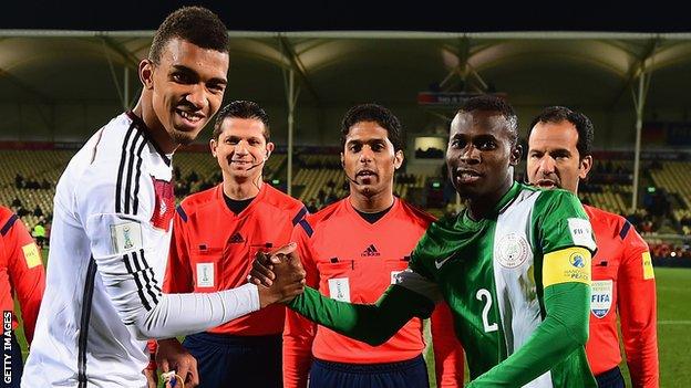 Kevin Akpoguma as captain of Germany at the 2015 Under-20 World Cup shake hands with Nigeria's captain Musa Mohamed