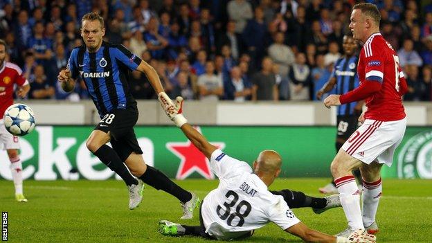 Manchester United striker Wayne Rooney scores against Club Brugge