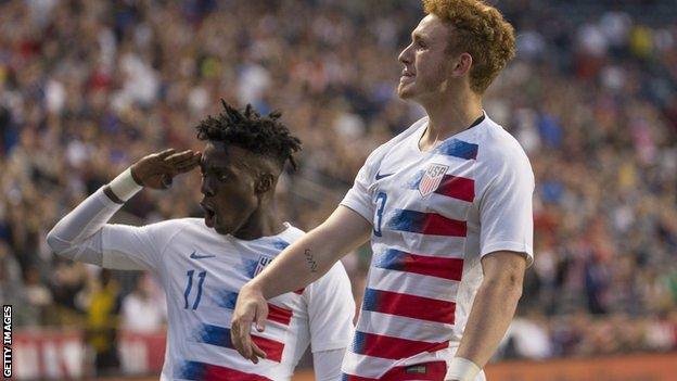 Timothy Weah celebrates his goal