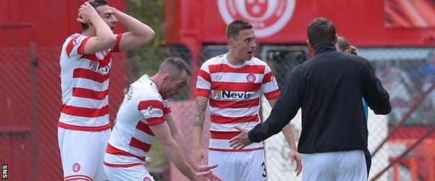 Hamilton players and manager Martin Canning complain about the first goal