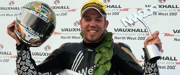 Peter Hickman celebrates his maiden NW200 success after winning the Superstock race