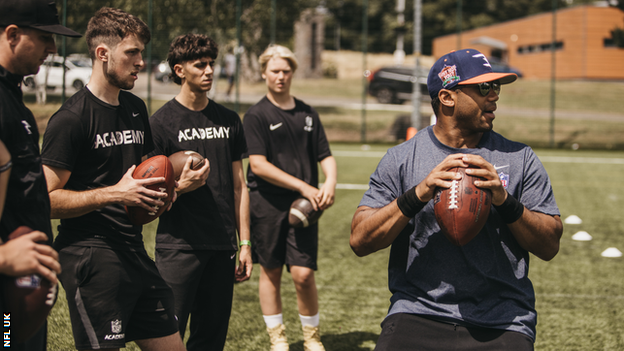 NFL Academy students with Russell Wilson