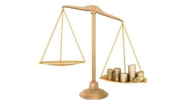 Money on scales