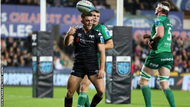 Scrum-half Reuben Morgan-Williams celebrates a second Ospreys try