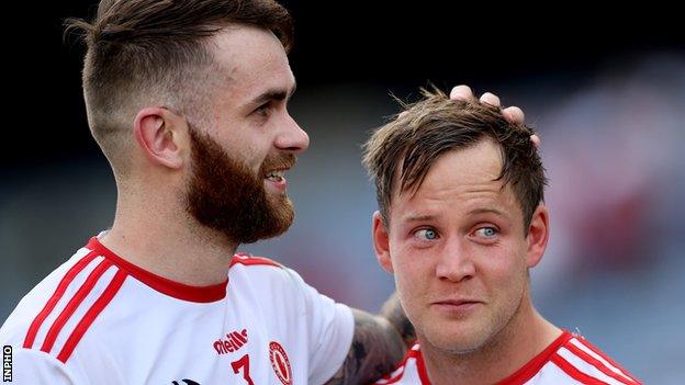 Ronan McNamee congratulates team-mate Kieran McGeary after Tyrone's win over Kerry