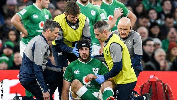 Ireland's medical staff attend to Caelan Doris after he sustained his early injury