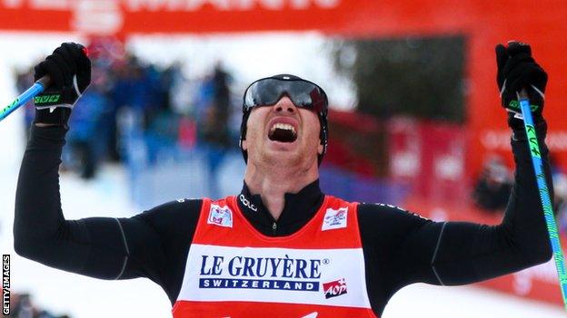 Dario Cologna celebrates victory in the Tour de Ski