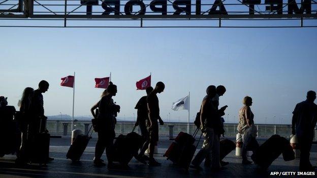 Tourists arrive at the Enfidha International airport on June 28