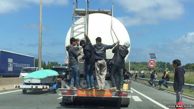 Migrants on the back of a tanker