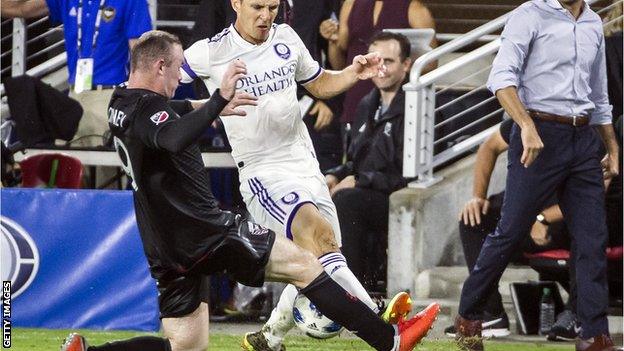 Wayne Rooney tackles Will Johnson