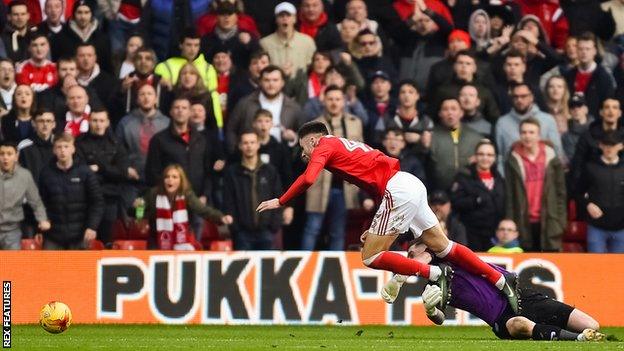 Sheffield Wednesday goalkeeper Keiren Westwood fouls Nottingham Forest's Ben Brereton to concede a penalty