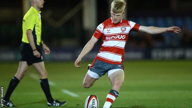 George Barton kicks at goal for Gloucester