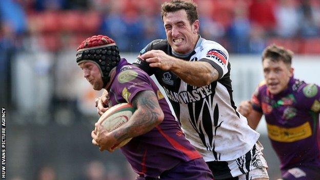 Ronny Kynes is tackled by Pontypridd's Dafydd Lockyer