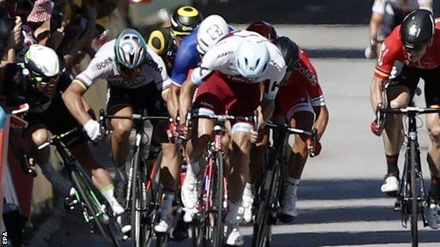 Mark Cavendish (far left) crashes with Peter Sagan next to him