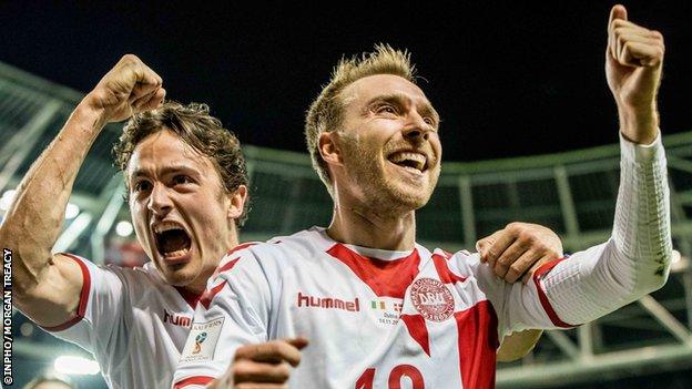 Denmark's Christian Eriksen celebrates his hat-trick goal with Thomas Delaney