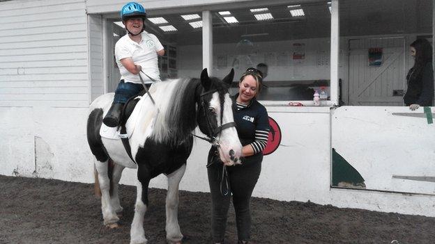 John Willis taking part in dressage on a horse