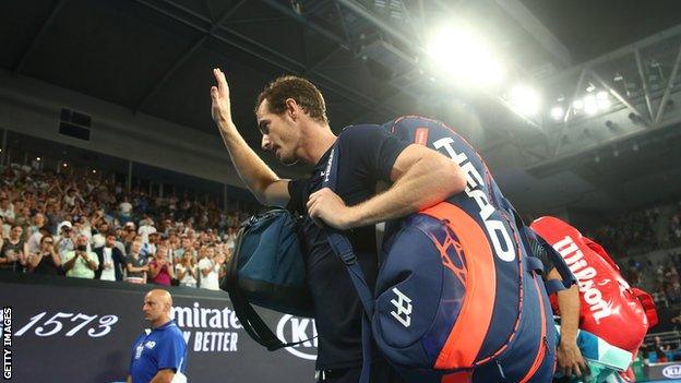 Andy Murray waves to the crowd as he leaves the Melbourne Arena after his Australian Open defeat by Roberto Bautista Agut