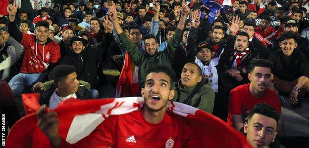 Al Ittihad fans watch a game in Martyrs' Square in Tripoli