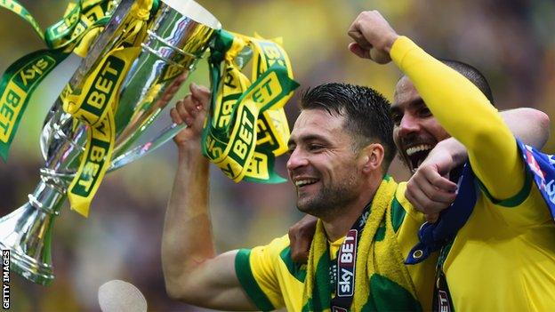 Russell Martin (left) celebrates Norwich getting promoted