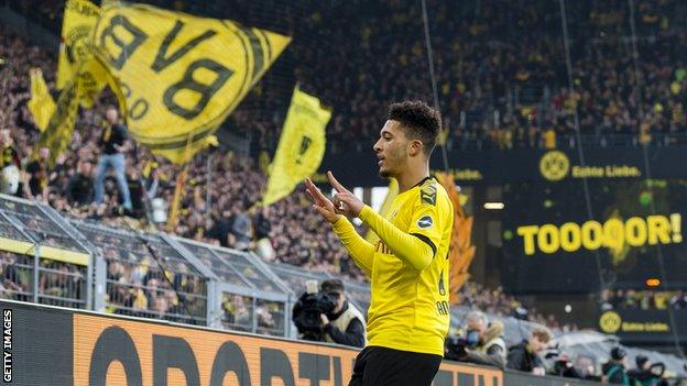 Jadon Sancho celebrates scoring