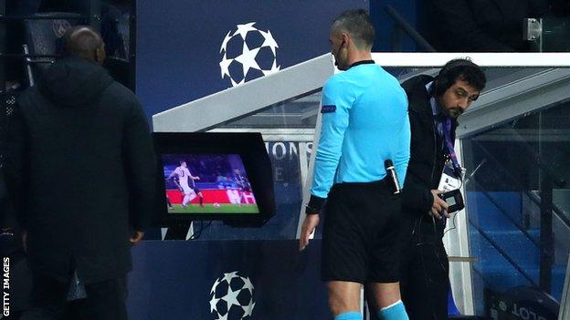 Referee Damir Skomina checks VAR