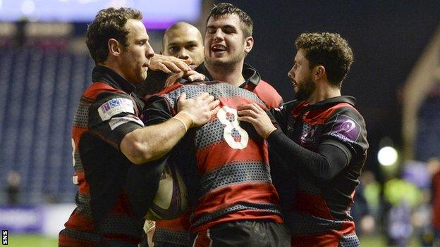 Edinburgh's Magnus Bradbury (8) celebrates his try with his team-mates